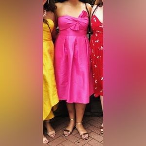 Hot pink strapless midi length dress